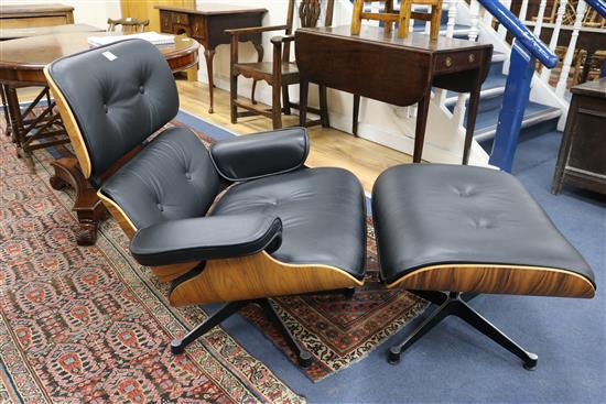 A reproduction Eames chair and stool